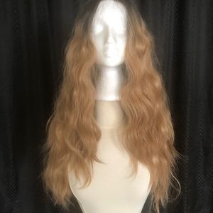 New never worn. Gorgeous balayage style 24 in long, lace front synthetic wig